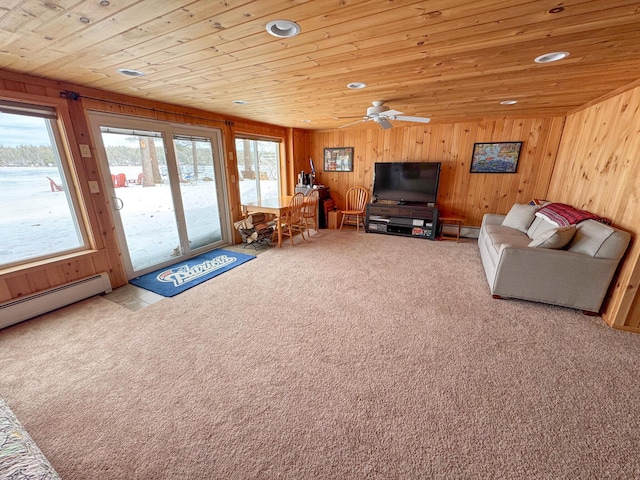 unfurnished living room with carpet floors, wooden walls, and wooden ceiling