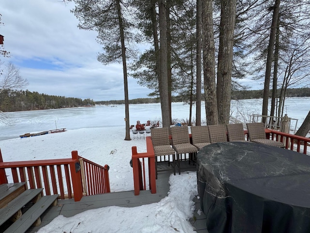 snow covered deck featuring grilling area