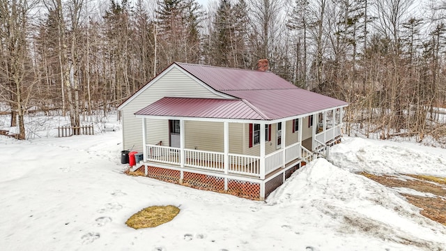 view of front of house with a porch and metal roof