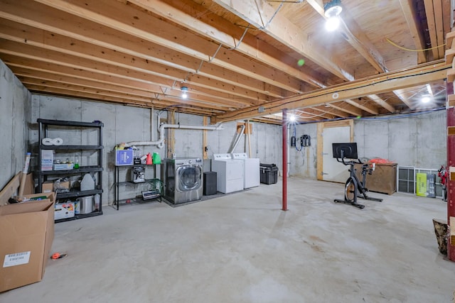 unfinished basement featuring separate washer and dryer