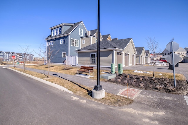 view of home's exterior featuring a residential view and a garage