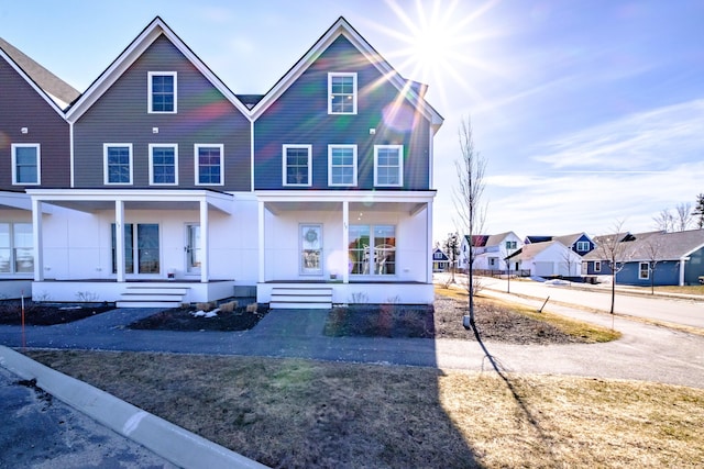 view of front of home with a residential view and covered porch