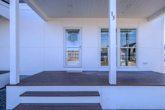 view of exterior entry with covered porch