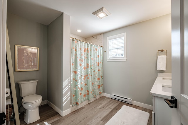 full bath with baseboards, toilet, wood finished floors, vanity, and a baseboard radiator