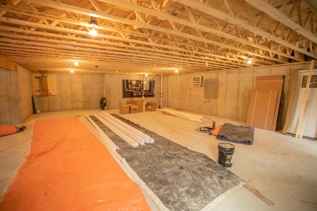 unfinished below grade area with an AC wall unit