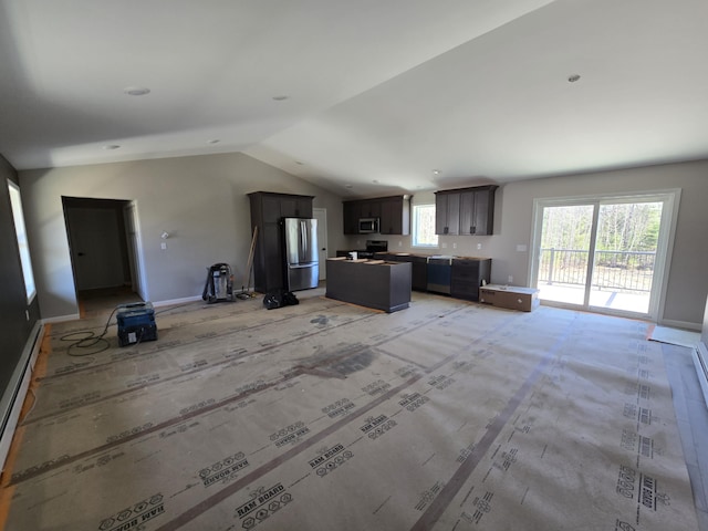 unfurnished living room featuring vaulted ceiling