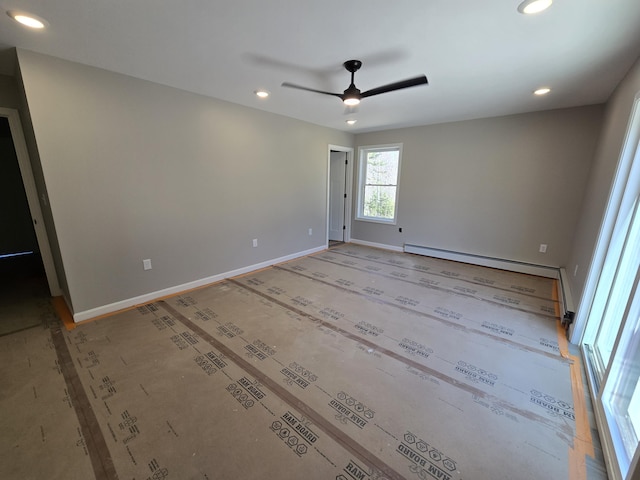 spare room featuring baseboard heating, ceiling fan, baseboards, and recessed lighting