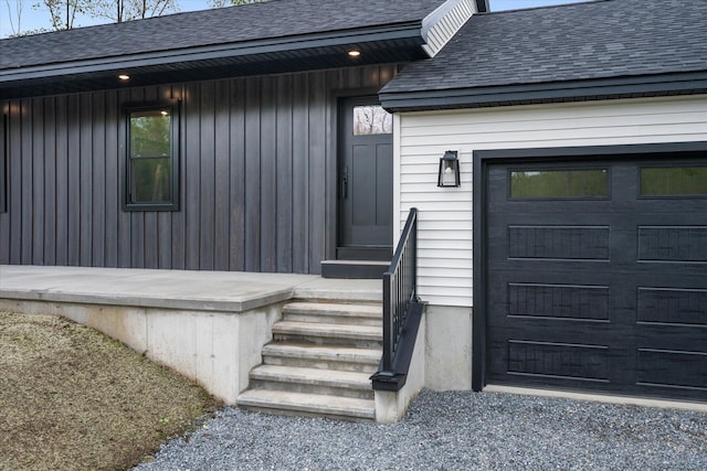 67 Stacey Ln, Kenduskeag, ME 04450 - entrance to property with a shingled roof and a garage
