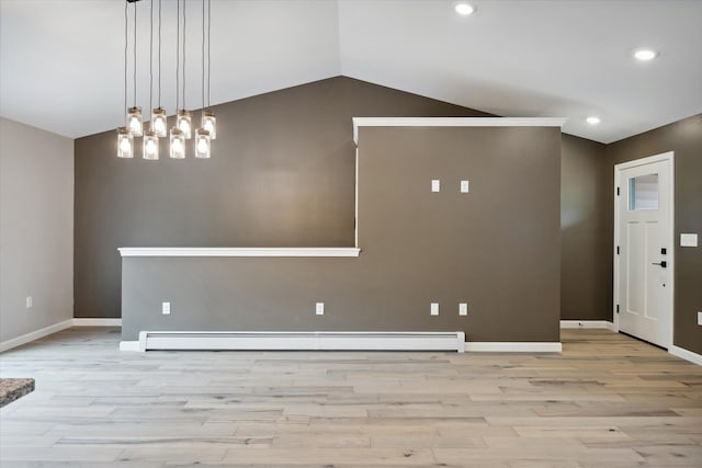 67 Stacey Ln, Kenduskeag, ME 04450 - spare room featuring light wood-type flooring, a baseboard heating unit, baseboards, lofted ceiling, and recessed lighting