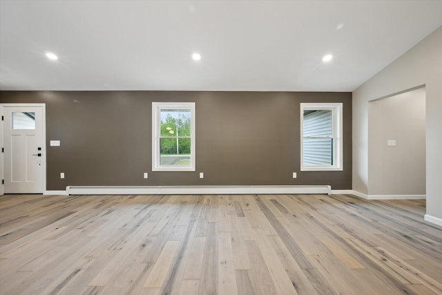 67 Stacey Ln, Kenduskeag, ME 04450 - unfurnished living room with light wood-type flooring, baseboard heating, baseboards, and recessed lighting