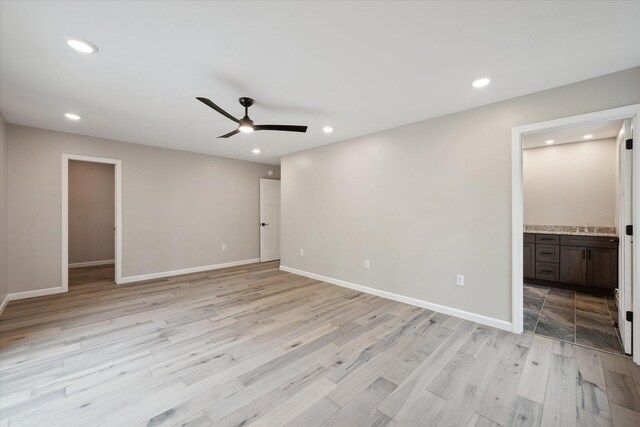 67 Stacey Ln, Kenduskeag, ME 04450 - unfurnished bedroom with recessed lighting, light wood finished floors, connected bathroom, baseboards, and a sink