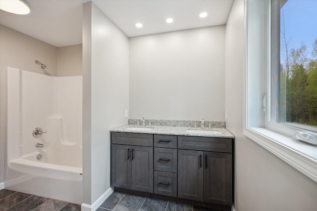 67 Stacey Ln, Kenduskeag, ME 04450 - full bathroom featuring shower / bath combination, baseboards, double vanity, and recessed lighting