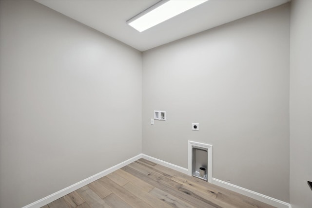 67 Stacey Ln, Kenduskeag, ME 04450 - laundry room featuring electric dryer hookup, washer hookup, light wood-style flooring, and baseboards