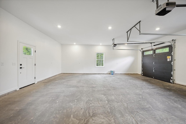 67 Stacey Ln, Kenduskeag, ME 04450 - garage featuring a garage door opener, recessed lighting, and baseboards
