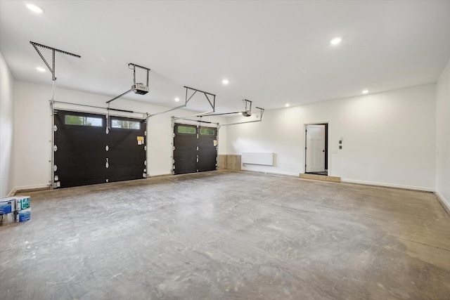 67 Stacey Ln, Kenduskeag, ME 04450 - garage featuring a garage door opener and recessed lighting