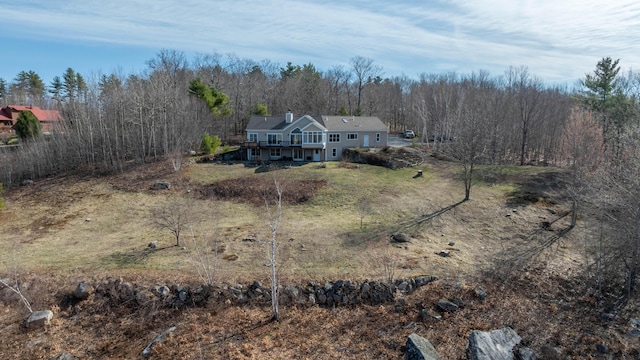 bird's eye view featuring a wooded view