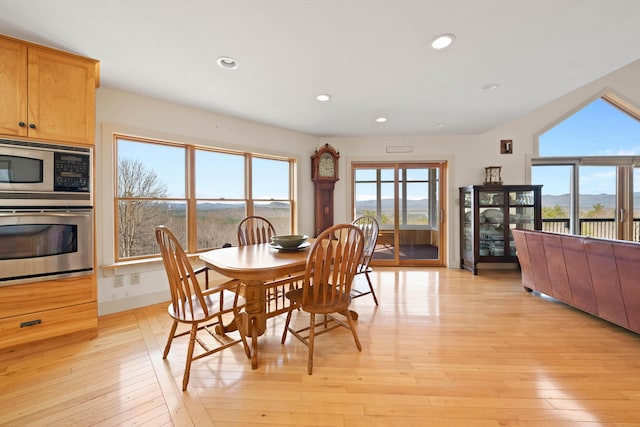 dining space with recessed lighting and light wood finished floors