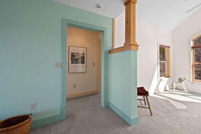 interior space featuring carpet flooring and baseboards