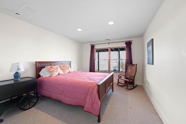 bedroom with recessed lighting, baseboards, light colored carpet, and visible vents