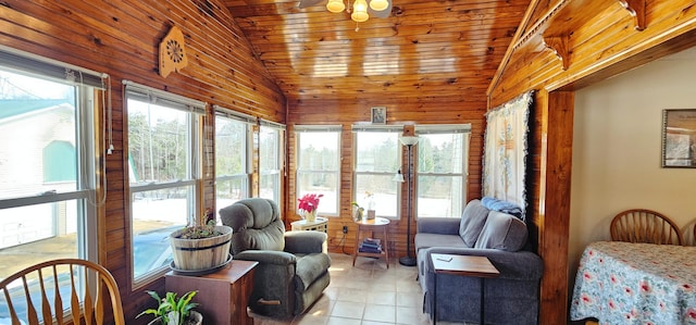 sunroom / solarium featuring wooden walls, vaulted ceiling, tile patterned flooring, and wooden ceiling