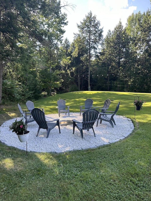 view of yard with a patio area and a fire pit