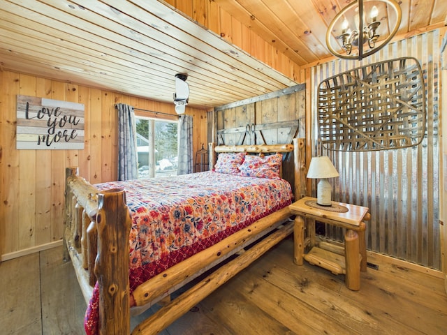 bedroom with hardwood / wood-style floors, a notable chandelier, wood walls, and wooden ceiling