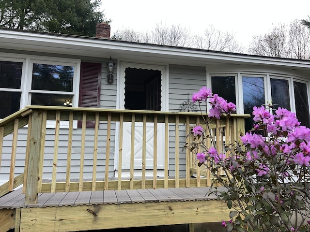 exterior space with a chimney and a deck