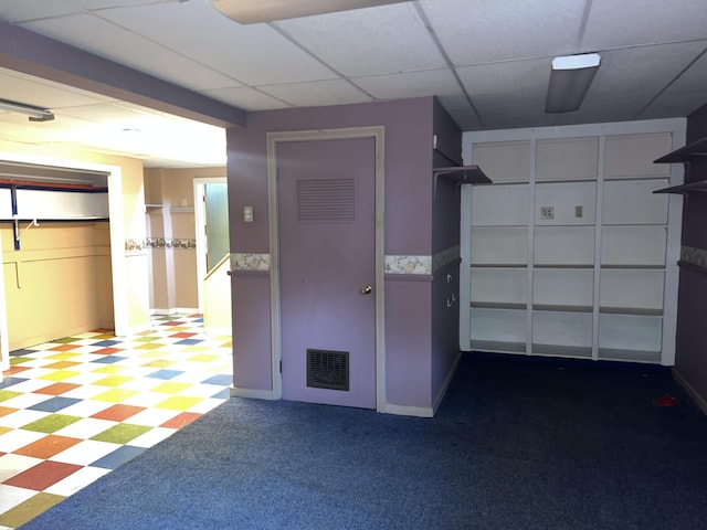 interior space featuring baseboards and visible vents