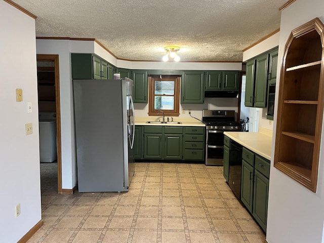 kitchen featuring a textured ceiling, stainless steel appliances, green cabinets, and a sink