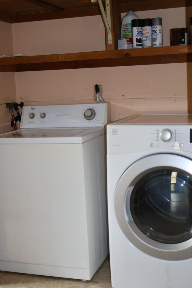 laundry area featuring washing machine and dryer and laundry area