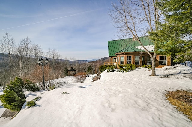 84 Ira Mountain Rd, Kingfield, ME 04947 - yard covered in snow featuring covered porch and a mountain view