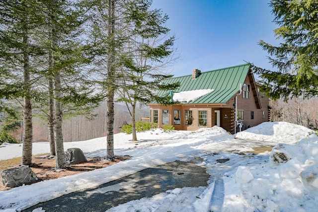 84 Ira Mountain Rd, Kingfield, ME 04947 - log-style house featuring a standing seam roof, a chimney, and metal roof