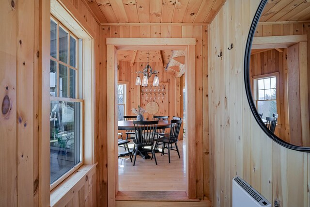 84 Ira Mountain Rd, Kingfield, ME 04947 - dining area with wood walls, wooden ceiling, wood finished floors, healthy amount of natural light, and a chandelier