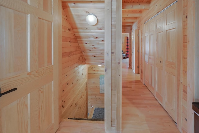 84 Ira Mountain Rd, Kingfield, ME 04947 - hall with wood walls, light wood finished floors, and wood ceiling with exposed beams