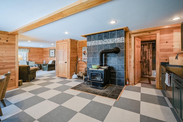 84 Ira Mountain Rd, Kingfield, ME 04947 - living room featuring wooden walls, a wood stove, and recessed lighting