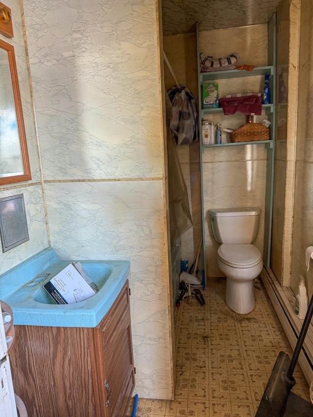 bathroom with baseboard heating, toilet, and walk in shower