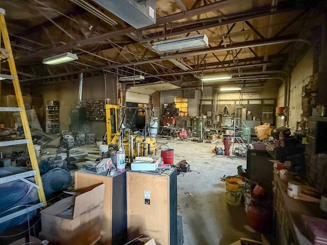 miscellaneous room featuring a garage and concrete flooring