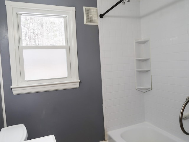 full bathroom with bathing tub / shower combination, toilet, and visible vents