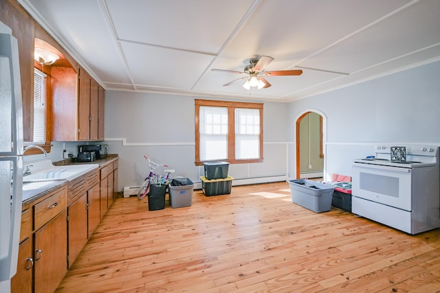 kitchen with a sink, electric stove, light wood-style floors, a baseboard heating unit, and baseboard heating