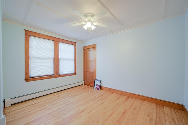 unfurnished room featuring a baseboard radiator, baseboards, wood finished floors, and a ceiling fan