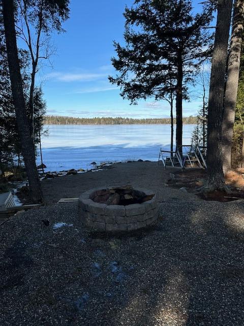 view of water feature featuring an outdoor fire pit