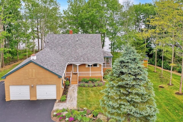 19 Glenview Ln, Belfast, ME 04915 - view of front facade with a chimney, covered porch, roof with shingles, and asphalt driveway