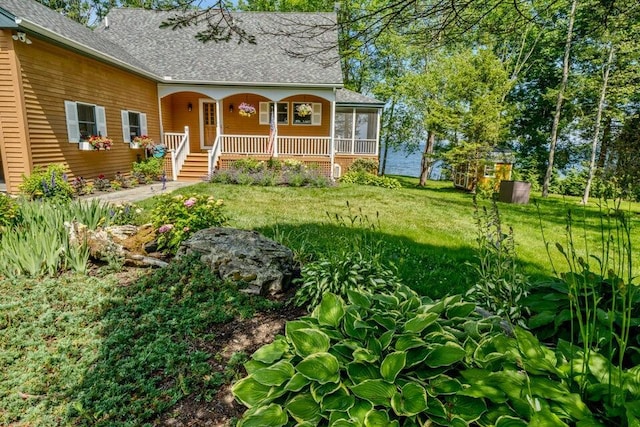 19 Glenview Ln, Belfast, ME 04915 - view of exterior entry with a porch, a yard, and roof with shingles