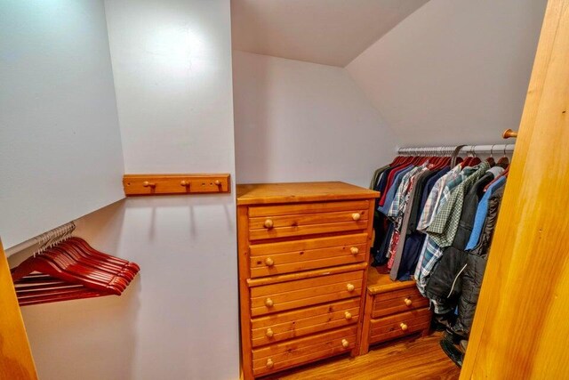 19 Glenview Ln, Belfast, ME 04915 - spacious closet with wood finished floors and vaulted ceiling