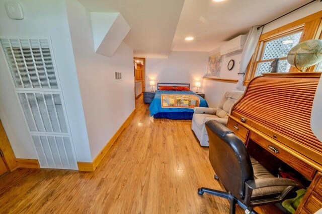 19 Glenview Ln, Belfast, ME 04915 - bedroom featuring wood finished floors, a wall unit AC, a heating unit, and recessed lighting