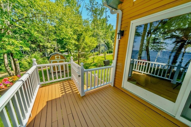 19 Glenview Ln, Belfast, ME 04915 - wooden terrace with a storage shed and view of scattered trees