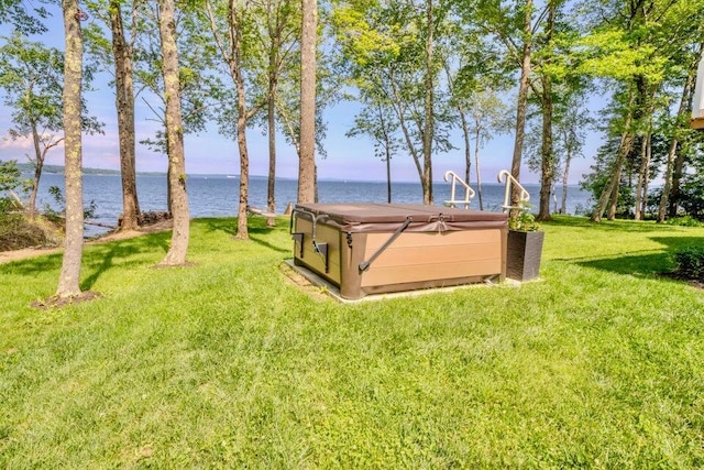 19 Glenview Ln, Belfast, ME 04915 - view of grassy yard with a hot tub and a water view