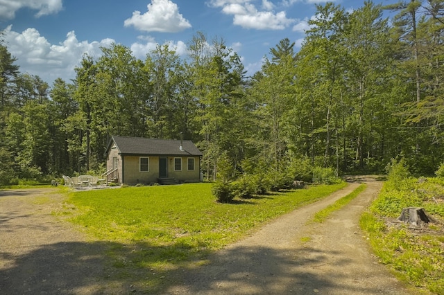 4 Boulder Cove Way, Bremen, ME 04551 - view of front of property featuring a view of trees, driveway, a front yard, and entry steps