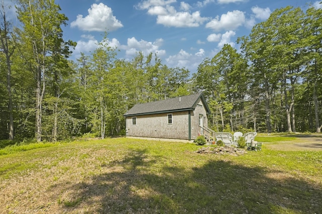 4 Boulder Cove Way, Bremen, ME 04551 - view of side of property with a lawn and a wooded view