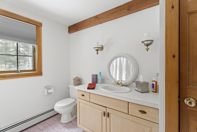 bathroom featuring vanity, beam ceiling, tile patterned flooring, toilet, and baseboard heating